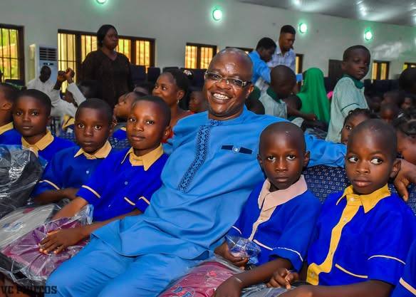 Founder seated with pupils